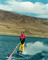 Erik on two skis with east shore of Pyramid Lake in background